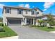 Beautiful home showcasing a manicured lawn and a spacious three-car garage at 16455 Whale Grey Pl, Bradenton, FL 34211