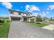 Charming two-story home featuring a spacious three-car garage and manicured lawn at 16455 Whale Grey Pl, Bradenton, FL 34211