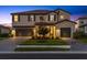 Charming two-story home with a well-manicured lawn, brick-paved driveway, and a two-car garage, enhancing curb appeal at 16455 Whale Grey Pl, Bradenton, FL 34211
