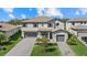 Beautiful two-story home with a well-manicured lawn and brick paver driveway at 16455 Whale Grey Pl, Bradenton, FL 34211