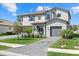 Beautiful two-story home with a well-manicured lawn and paver driveway at 16455 Whale Grey Pl, Bradenton, FL 34211