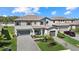 Beautiful two-story home with a well-manicured lawn and brick paver driveway at 16455 Whale Grey Pl, Bradenton, FL 34211