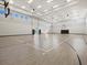 The gymnasium has basketball hoops and a shiny wood floor at 16455 Whale Grey Pl, Bradenton, FL 34211