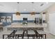 Kitchen featuring stainless steel appliances, a large island with seating, and modern pendant lighting at 16455 Whale Grey Pl, Bradenton, FL 34211