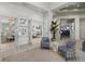 The community lounge is elegantly decorated with neutral tones and plenty of natural light at 16455 Whale Grey Pl, Bradenton, FL 34211