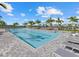 This large lap pool has lane markings for exercise and plenty of chairs for relaxing at 16455 Whale Grey Pl, Bradenton, FL 34211