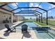 Stunning pool area featuring a built-in spa, comfortable seating, and a screened-in enclosure at 16455 Whale Grey Pl, Bradenton, FL 34211