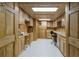 Spacious basement featuring wood-paneled walls, ample storage, and functional workspace at 16719 Ellsworth Ave, Bradenton, FL 34202