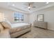 Neutral bedroom with ceiling fan and bright window at 16719 Ellsworth Ave, Bradenton, FL 34202