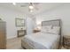 Bright bedroom with a ceiling fan, neutral colored walls and decor at 16719 Ellsworth Ave, Bradenton, FL 34202