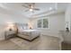 Calming bedroom with a ceiling fan and neutral colored walls and decor at 16719 Ellsworth Ave, Bradenton, FL 34202