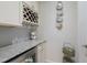 Stylish butler pantry with granite counters, a wine rack, and under-counter refrigerator at 16719 Ellsworth Ave, Bradenton, FL 34202