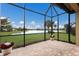 Water view from screened-in lanai showcasing serene outdoor living space at 16719 Ellsworth Ave, Bradenton, FL 34202