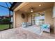 Covered lanai with comfortable seating, perfect for outdoor entertaining and relaxation at 16719 Ellsworth Ave, Bradenton, FL 34202