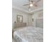 Comfortable main bedroom featuring neutral tones, tray ceiling, and ceiling fan at 16719 Ellsworth Ave, Bradenton, FL 34202