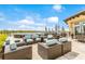 Outdoor seating includes comfortable chairs and tables with umbrellas for shade at 16719 Ellsworth Ave, Bradenton, FL 34202