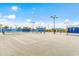 Community tennis courts feature well-lit playing surfaces and comfortable shaded seating, perfect for an active lifestyle at 16719 Ellsworth Ave, Bradenton, FL 34202