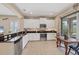 Modern kitchen featuring white cabinets, granite countertops, and stainless steel appliances at 21037 Anclote Ct, Venice, FL 34293