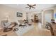 Inviting living room with light wood floors, neutral walls, and comfortable seating at 21037 Anclote Ct, Venice, FL 34293