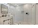 Modern bathroom with tiled shower, glass door, and stylish vanity at 2141 Hyde Park St, Sarasota, FL 34239