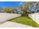 Backyard features privacy fence and concrete patio at 2411 28Th E Ave, Palmetto, FL 34221