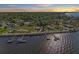 Waterfront neighborhood featuring lush trees and greenery with home and private dock at 2512 Riverside E Dr, Bradenton, FL 34208