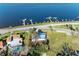 Charming waterfront home featuring boat docks, mature trees, and picturesque coastal living at 2512 Riverside E Dr, Bradenton, FL 34208