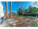Spacious backyard featuring mature trees, lush grass, and ample room for outdoor activities at 2512 Riverside E Dr, Bradenton, FL 34208