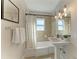 Bathroom featuring a shower/tub combination, large mirror, and vanity with a sink at 2512 Riverside E Dr, Bradenton, FL 34208
