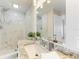 Bathroom featuring a walk in shower, granite countertops, and white marble backsplash at 2512 Riverside E Dr, Bradenton, FL 34208
