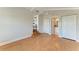 Bedroom with hardwood floors, ensuite bath, and walk-in closets at 2512 Riverside E Dr, Bradenton, FL 34208