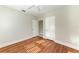 Bedroom featuring hardwood floors, two closets and a ceiling fan at 2512 Riverside E Dr, Bradenton, FL 34208