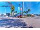 Charming community pier with brick pathway lined with palm trees, providing serene waterfront access for residents at 2512 Riverside E Dr, Bradenton, FL 34208