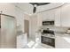 Kitchen featuring stainless steel appliances, marble floors, and granite countertops at 2512 Riverside E Dr, Bradenton, FL 34208