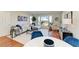 Bright living room features a neutral sectional, water view, and hardwood floors at 2512 Riverside E Dr, Bradenton, FL 34208