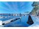 Peaceful waterfront view featuring docks and boats, highlighting the community's access to the water and amenities at 2512 Riverside E Dr, Bradenton, FL 34208