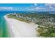 Expansive aerial view showcasing the beautiful coastline with sandy beaches and turquoise waters at 2530 Loma Linda St, Sarasota, FL 34239