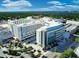 Aerial shot of Sarasota Memorial Hospital with views of the bay, lush landscaping, and palm trees at 2530 Loma Linda St, Sarasota, FL 34239