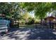 Large wooden deck surrounded by a lush green backyard and privacy fence at 2530 Loma Linda St, Sarasota, FL 34239