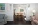 Inviting dining room featuring a wooden table set for six, filled with natural light at 2530 Loma Linda St, Sarasota, FL 34239