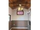 Cozy interior with wood ceiling, stained glass window, beadboard walls, and wood flooring at 2530 Loma Linda St, Sarasota, FL 34239