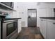 Modern kitchen featuring stainless steel appliances, granite countertops, and ample cabinet space at 2530 Loma Linda St, Sarasota, FL 34239