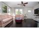 Comfortable living room with ceiling fan, showcasing stylish furnishings and decor at 2530 Loma Linda St, Sarasota, FL 34239