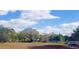 Outdoor park featuring recreational picnic benches under a sunny sky and lush greenery at 2530 Loma Linda St, Sarasota, FL 34239