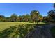 Serene park view with open green space, mature trees, and walking path at 2530 Loma Linda St, Sarasota, FL 34239