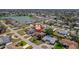Aerial view of property shows proximity to a nearby lake and neighborhood amenities at 260 Hammock Ter, Venice, FL 34293