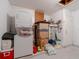 Basement area with washer, dryer, water heater and storage space at 260 Hammock Ter, Venice, FL 34293
