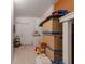Basement features a washer and dryer, storage boxes, and a side door at 260 Hammock Ter, Venice, FL 34293