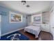 Light blue bedroom features built-in shelves, white trim, and a cozy queen bed at 260 Hammock Ter, Venice, FL 34293