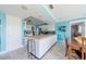 Charming kitchen features blue accents, ample counter space, and modern appliances at 260 Hammock Ter, Venice, FL 34293